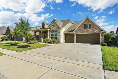 Double Wide Driveway Leading to Three Car Garage