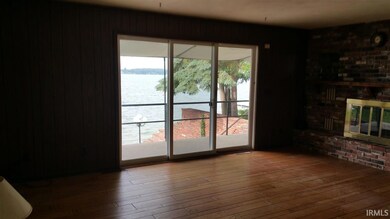 Living room on main level with wood floors, firepl