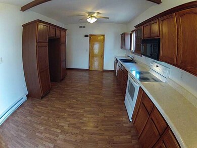 Kitchen. With tons of cabinets comes a lot of coun