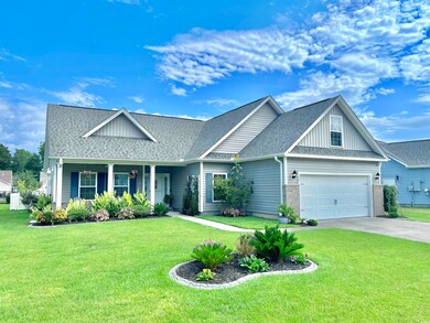 View of front of house with a garage and a front l
