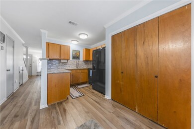 Kitchen featuring black fridge with ice dispenser,