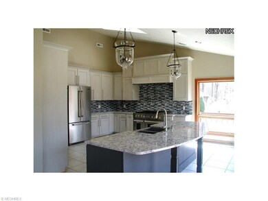 Gourmet kitchen w/quartz countertops and Jenn-air 