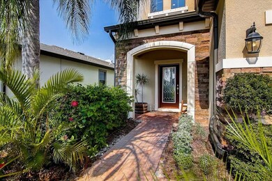 Mature landscaping leads to your covered entrance 