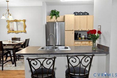 Kitchen and dining with bar stool seating.
