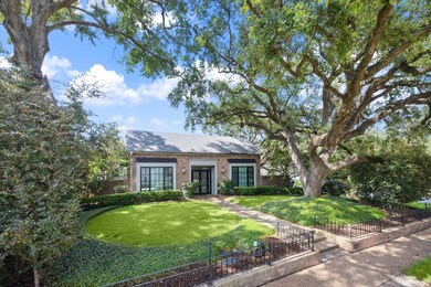 Charming residence nestled on a picturesque corner lot.