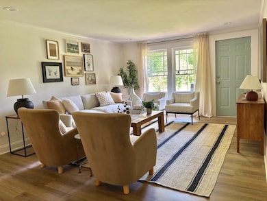 bright & sunny family room with plenty of room for all of your friends and family