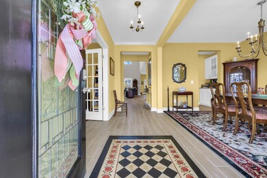 Foyer featuring a chandelier and wood finished floors