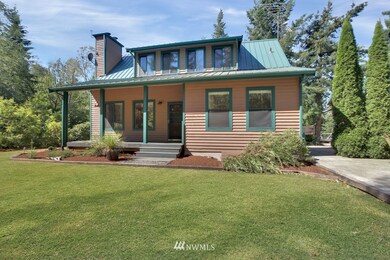 Charming covered porch, metal roof & fresh exterior paint!