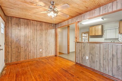 LIVING ROOM FLOWS INTO KITCHEN.
