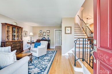 LIVING ROOM WITH GLEAMING HARDWOOD FLOORS