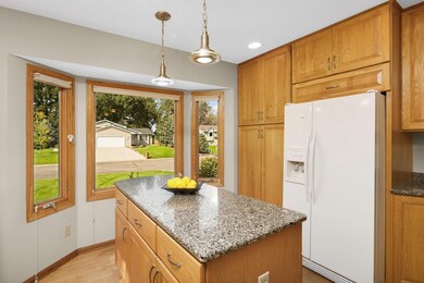 Charming pendant lights adorn the kitchen island.