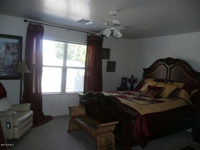Large master suite overlooking pool