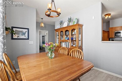 Dining area with newer light fixture