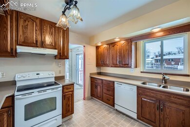 Kitchen featuring a wealth of natural light, sink,