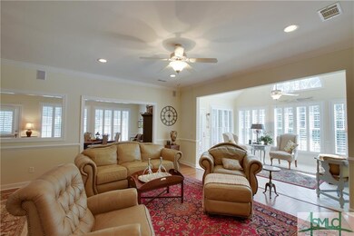 View from great room into sunroom and into the ope