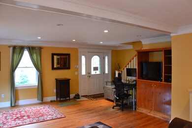 looking across living room toward front door