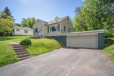 View of front facade with a garage and a front yar