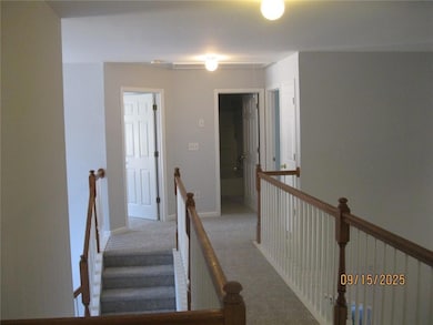 Stairway featuring carpet and baseboards
