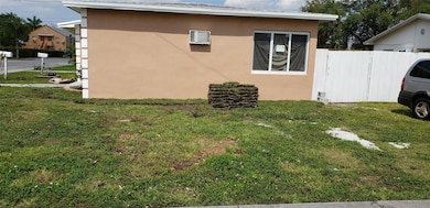 Side of building to park extra car, boat, trailer.  Prior approval required.