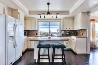 Kitchen island with granite countertops and wood f