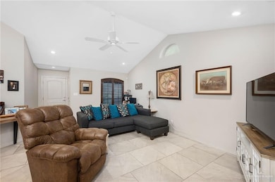 Living room featuring recessed lighting, high vaulted ceiling, and ceiling fan