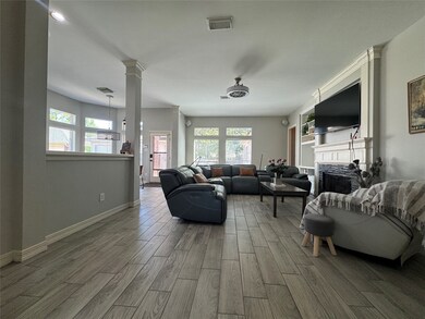 This spacious living area features modern sleek wo