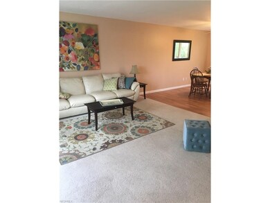 View of Living Room with Dining Room in background