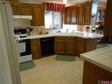 Large kitchen with tile counters, plenty of cabine