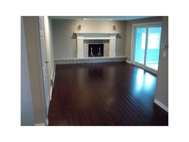 Family Room. Woodburning fireplace. Slider to Sunr