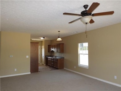 As you step into the large open living area, you will note the gorgeous modern neutral colors on the walls and flooring!
