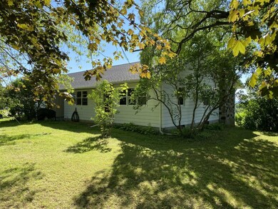 Nicely shaded front and side yard