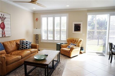 LIVING ROOM WITH GLIMPSE OF OUTSIDE PATIO