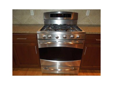 Kitchen. High end GE Profile gas stove with convec