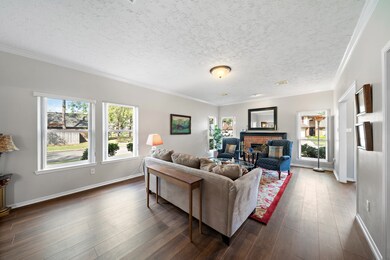 The spacious living room features beautiful new vi