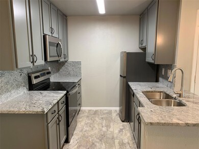 Kitchen featuring stainless steel appliances, a s