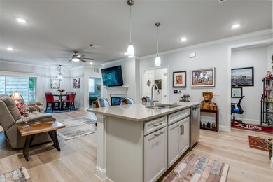 Kitchen featuring crown molding, light hardwood / 