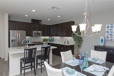 Model photo.  This kitchen/dining area are open to