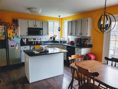 Updated kitchen with new back splash and light fix