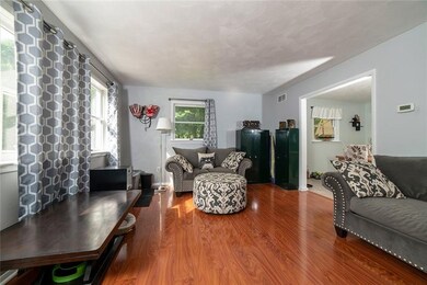 LIVING ROOM WITH GLEAMING FLOORS AND WEST FACING W