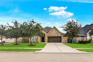 Upgraded Exterior elevation of brick and stone on a low traffic street. Professionally landscaped front, back and side yards.
