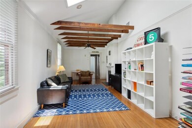 Exposed wood beams add to the charm of the room .