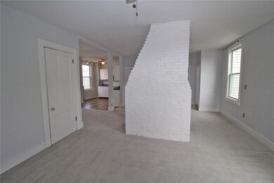 Living Room. Coat Closet on the left. Kitchen beyo