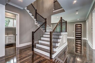 Wide planked stairwell that makes the upstairs fee