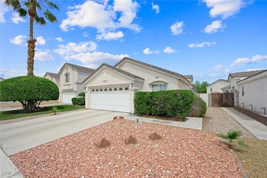 View of front facade featuring concrete driveway,