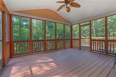 Screened in deck and two open deck areas with under-decking over the patio.