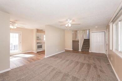 Unfurnished living room with light carpet and ceil