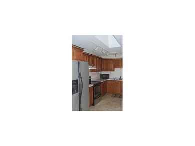 Kitchen. Stainless steel appliances and a skylight