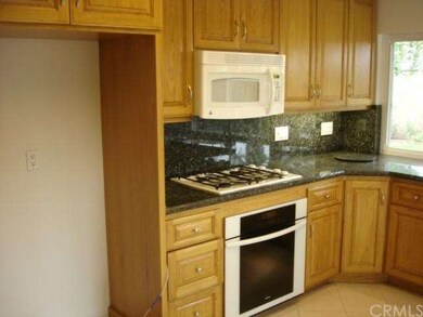Lots of Cabinets in Kitchen with Pantry on Left no
