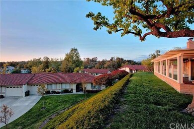 This property sits on a hill wrapped by lush green