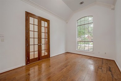 Enter through striking wood French doors into a sp